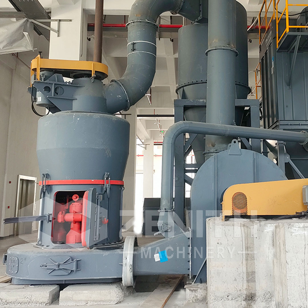 Technician cleaning a grinding mill